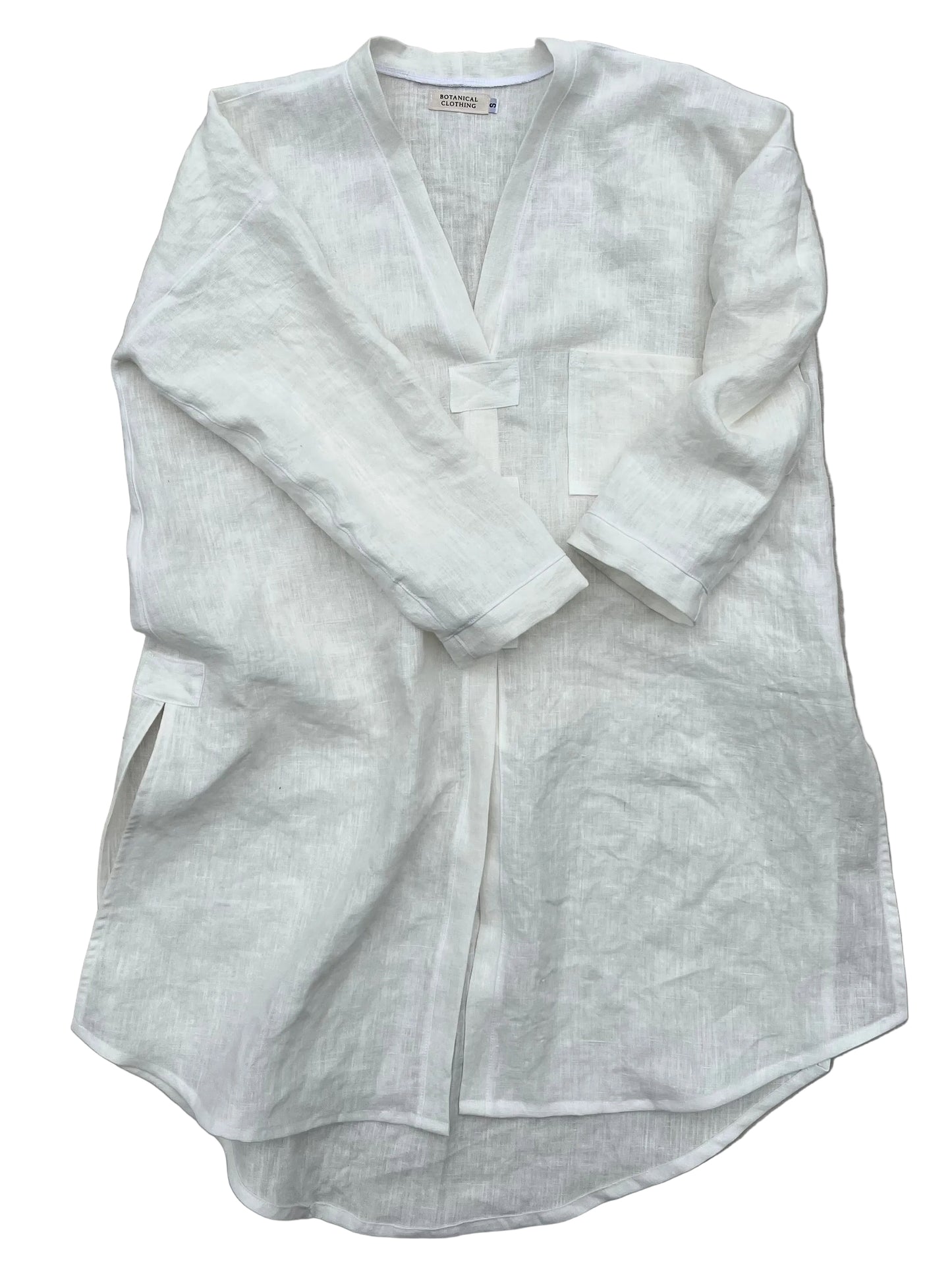 White hemp tunic on a gray background
