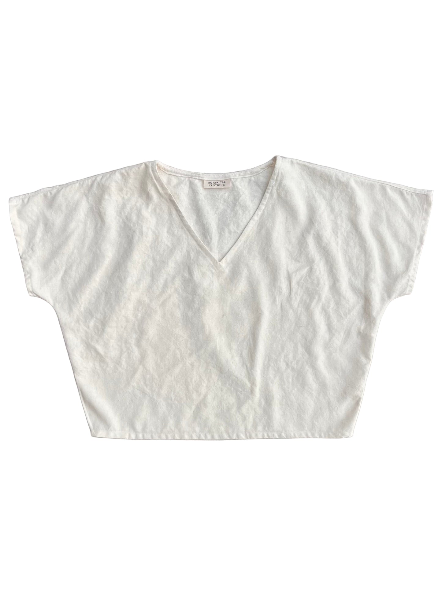 White blouse with a V-neck on a white background