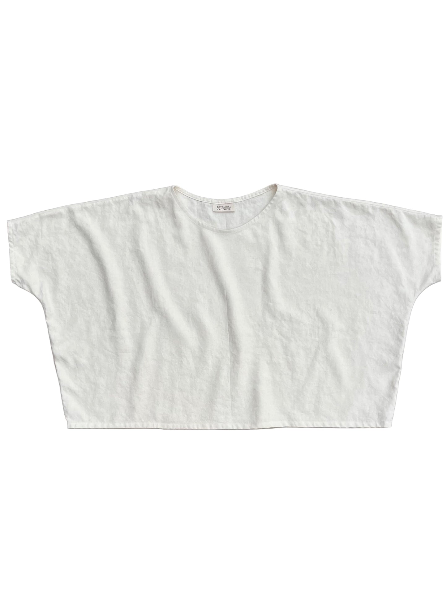 White crop top on a gray background