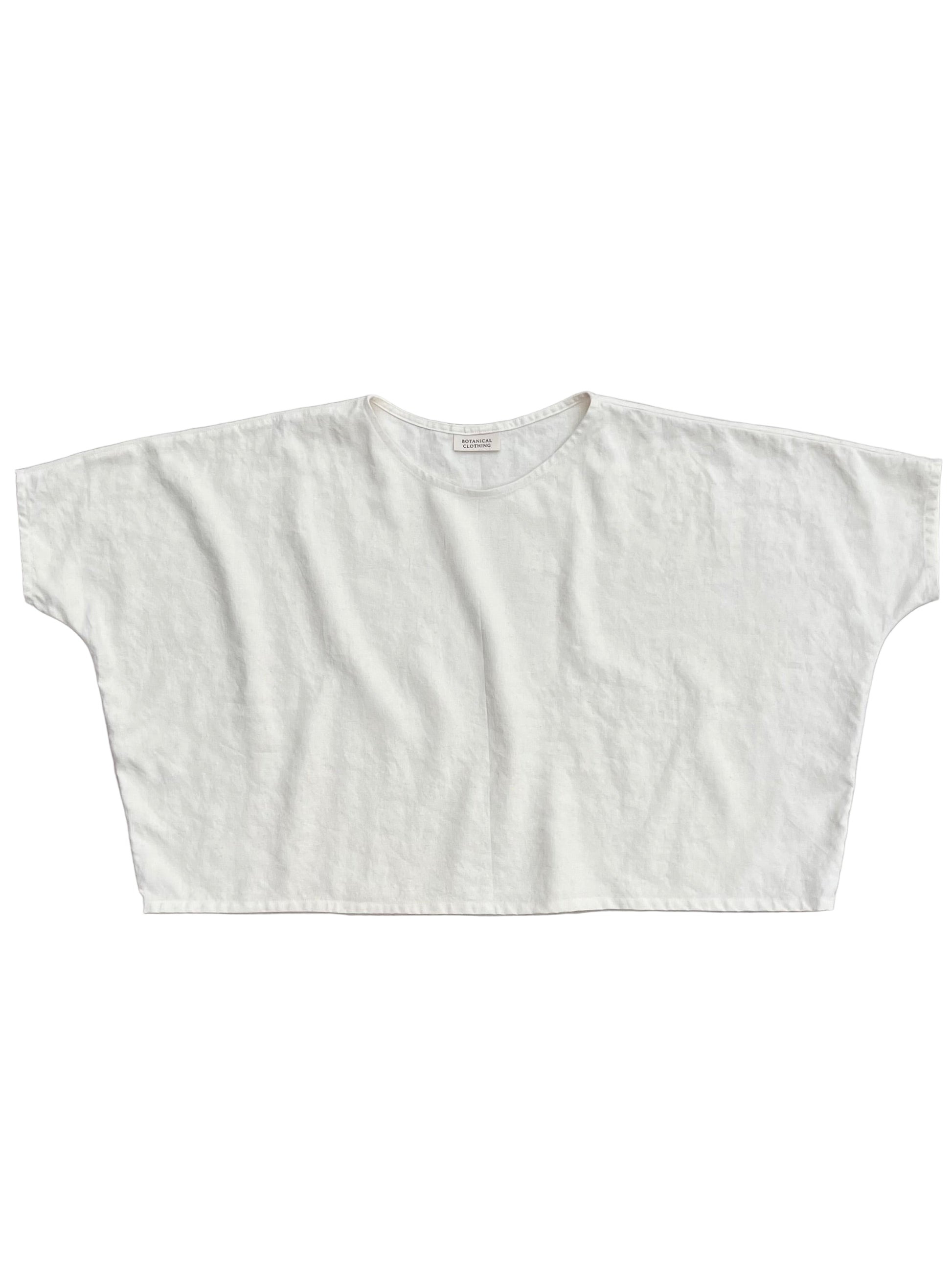 White crop top on a gray background